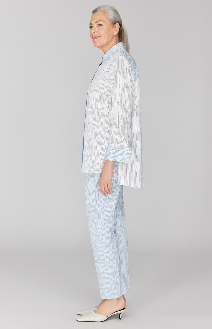 Fabienne is 5' 9" and wearing White in size XS.