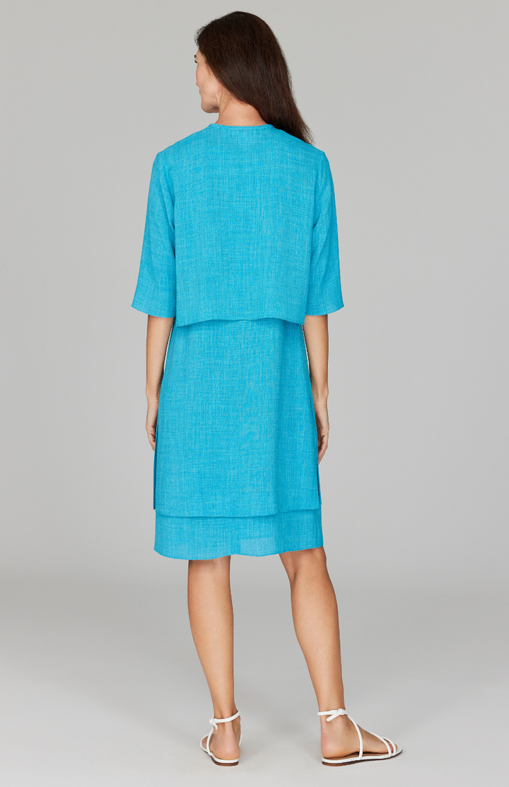 Ekaterina is 5'10" and is wearing a size XS in Cyan.