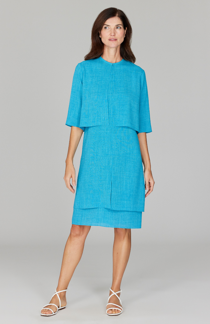 Ekaterina is 5'10" and is wearing a size XS in Cyan.