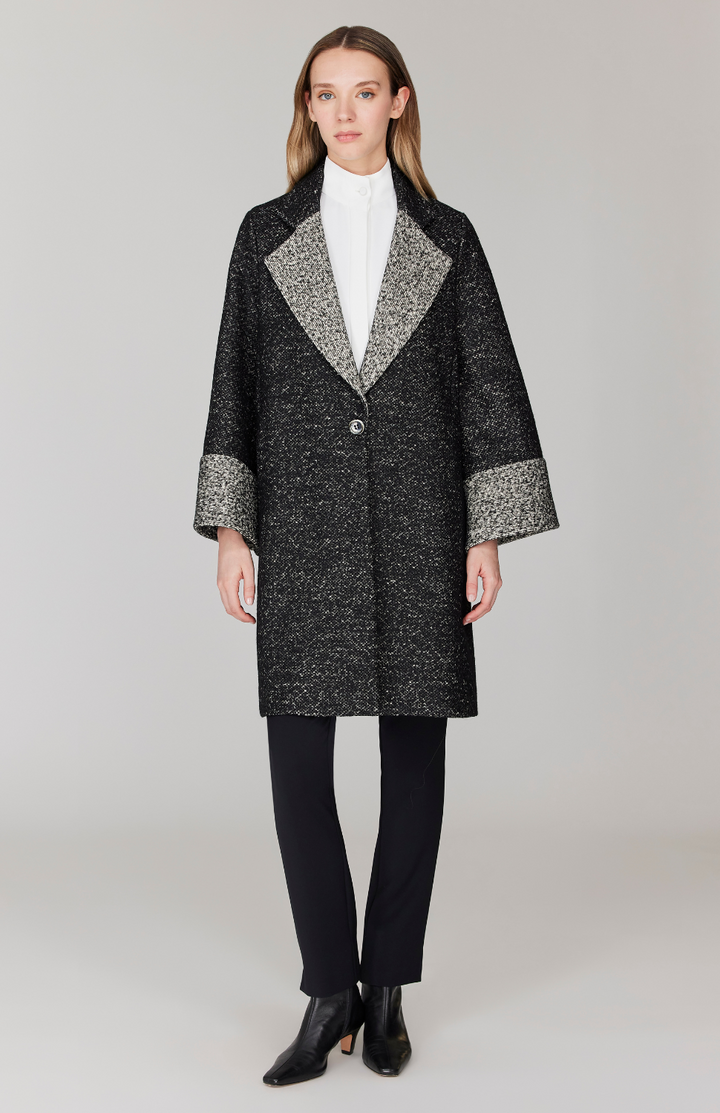 Morgan is 5' 11" and wearing Black and White in size XS.