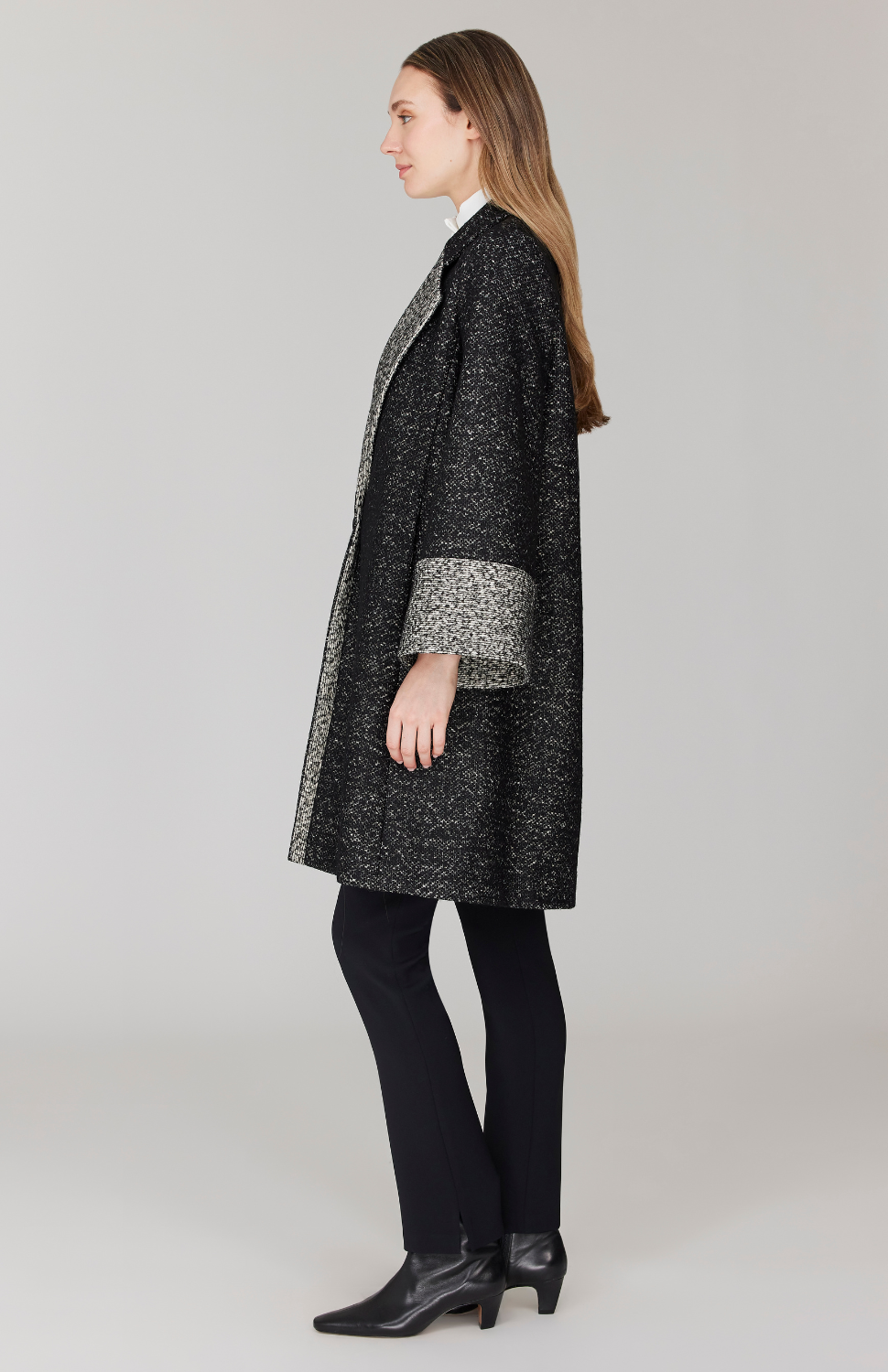 Morgan is 5' 11" and wearing Black and White in size XS.