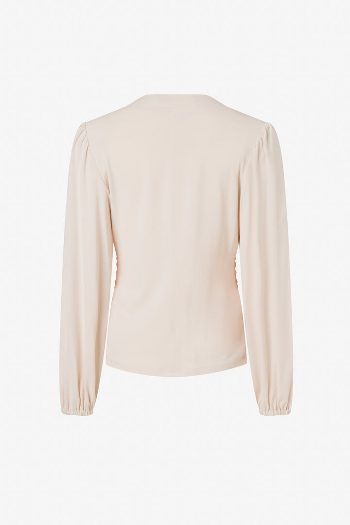 Long sleeve top with roushing