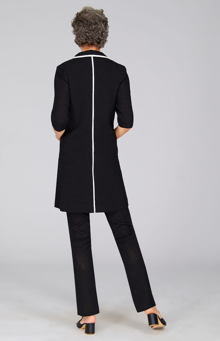 Nancy is wearing Black in size XS.