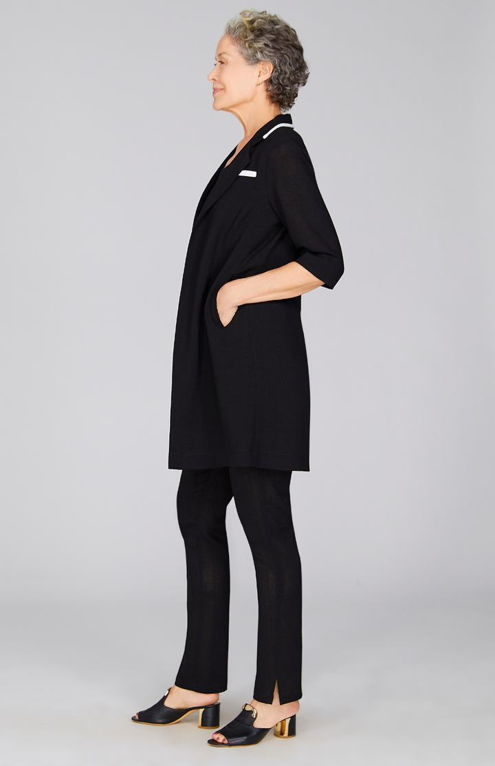 Nancy is wearing Black in size XS.